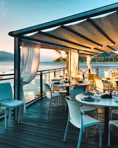 Waterfront restaurant terrace at sunset