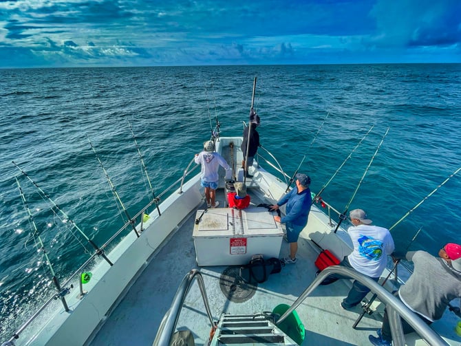 Anglers on a deep-sea fishing charter heading offshore